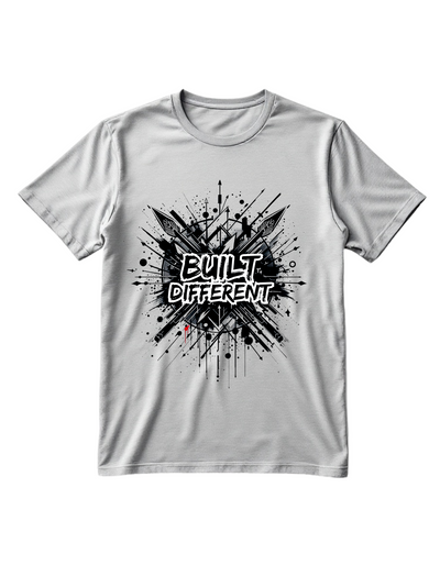 Grey t-shirt with custom DTF printed Built Different design featuring black explosion effect and white graffiti style text
