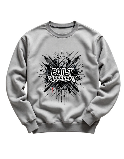 Grey crewneck sweatshirt with custom DTF printed Built Different design featuring black explosion effect and white graffiti style text